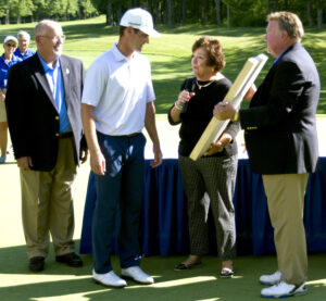 LECOM's board of trustees presents LECOM Health Challenge Trophy to Rick Lamb at Peak N'Peak Golf Course.