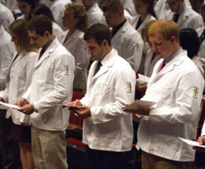 College of Medicine students from the Class of 2020 recite the Pledge of Commitment during the LECOM Erie White Coat Ceremony.