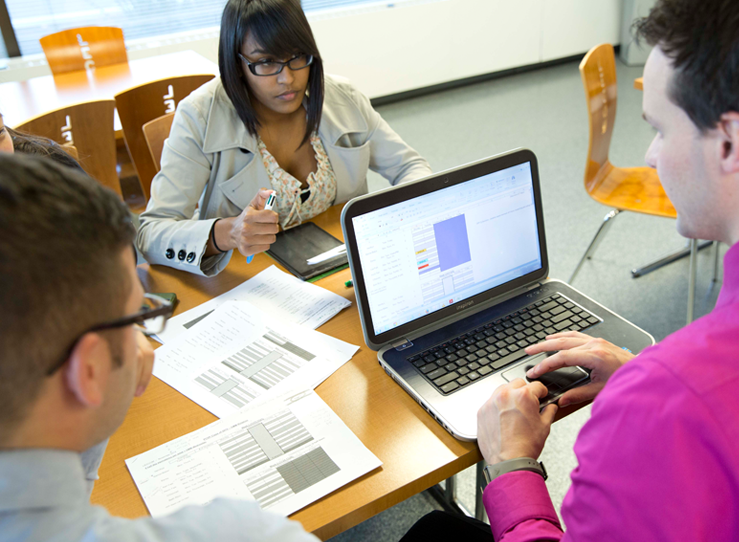 Black female and male student studying in library at LECOM in Erie, PA