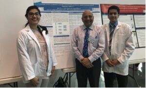 Osteopathic medical students presenting mango and cancer prevention work.