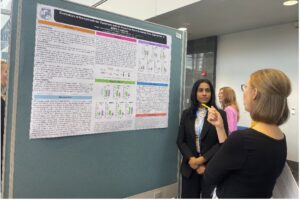 Professor being asked question in front of whiteboard